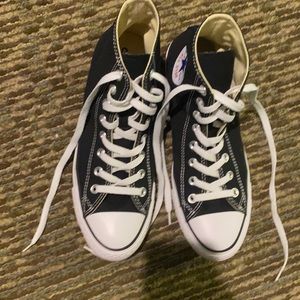 Black high top Chuck Taylor allstar converse shoes